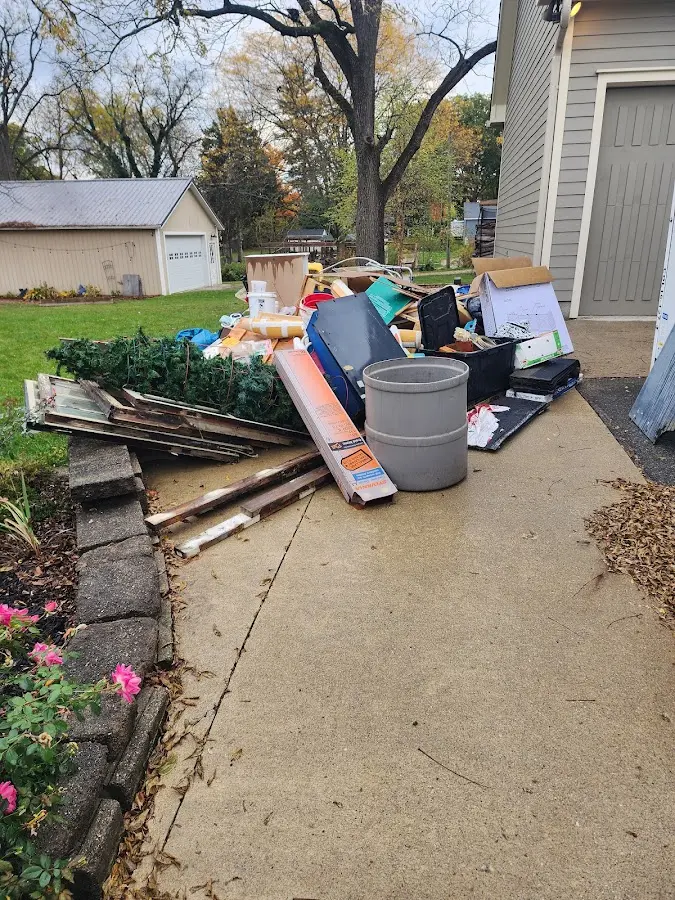 Dumpster being loaded with debris for Roofing Dumpster Rental in Vista